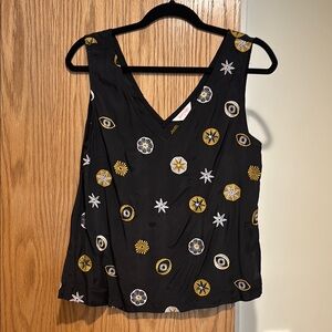 Black Sleeveless Top with Gold and White Pattern